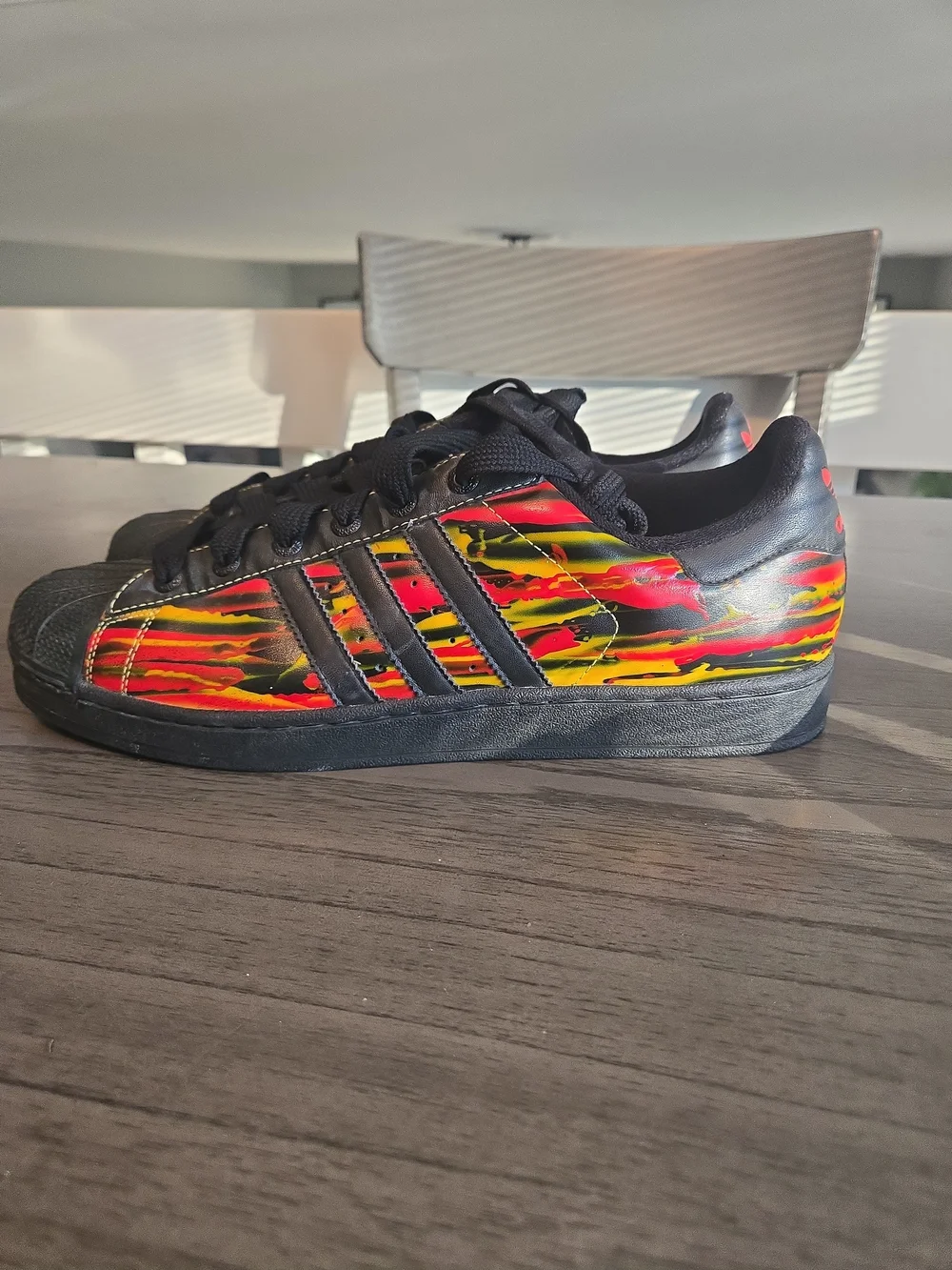 Adidas Black Superstar Sneakers with Red & Yellow Graphic